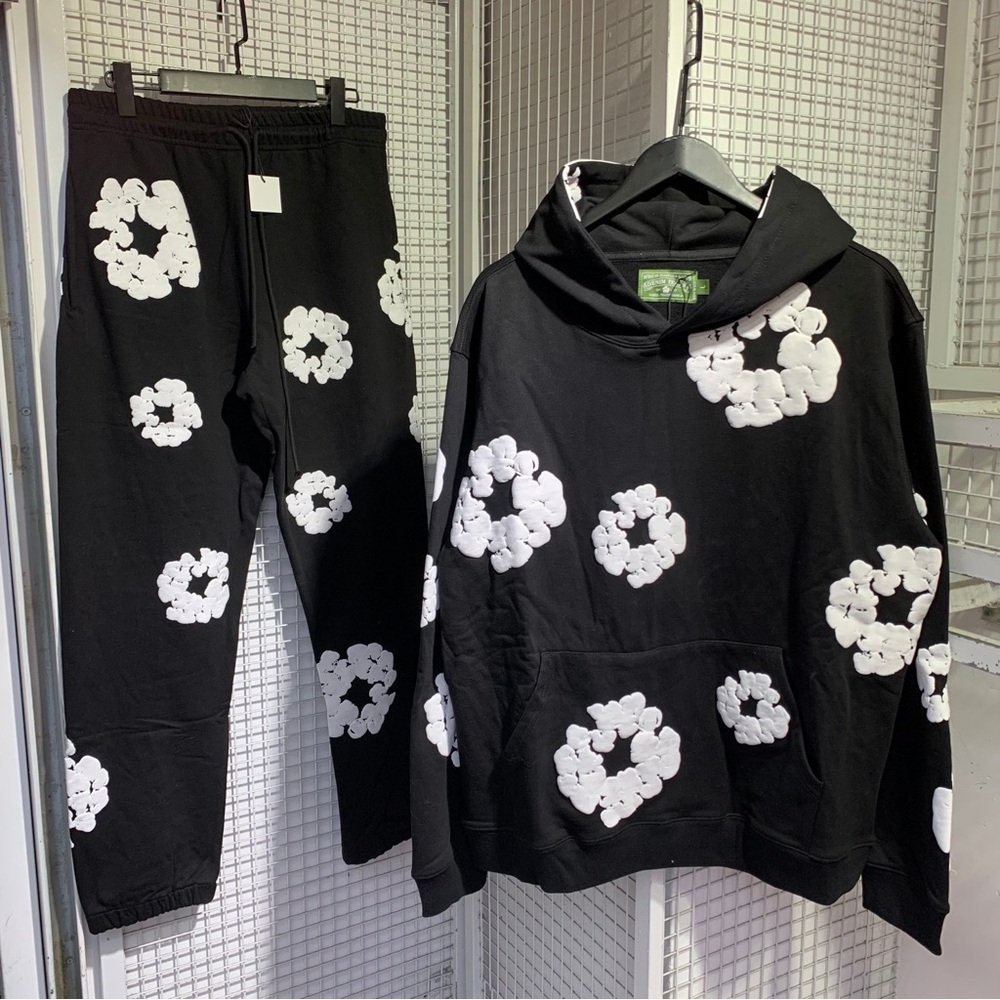 denim tears Stylish Black Hoodie with White Floral Design